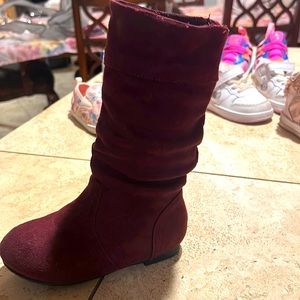 Knee high boots.  A lil scuffed on the front. They are burgundy